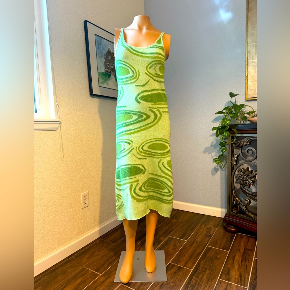Unbranded body-skimming, back-cut-out green knit tank dress. Size small.